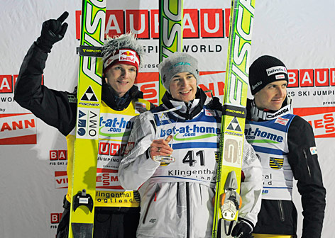 © AP/Jens Meyer Thomas Morgenstern (Österreich), Kamil Stoch (Polen) und Simon Ammann (Schweiz)