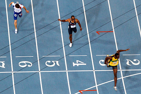 © AP/David J. Phillip Zieleinlauf von Usain Bolt, Walter Dix und Christophe Lemaitre