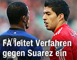 Luis Suarez (Liverpool) and Patrice Evra (Manchester United)