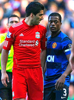 © AP/Tim Hales Luis Suarez (Liverpool) and Patrice Evra (Manchester United)