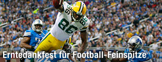Donald Lee (Green Bay Packers) mit Louis Delmas, DeAndre Levy und Marvin White (Detroit Lions)