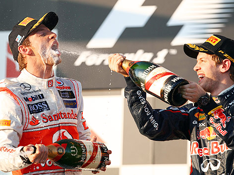 © APA/EPA/Jens Buettner Jenson Button und Sebastian Vettel feiern