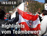 Fans mit &Ouml;sterreichflagge vor der Skiflugschanze in Planica