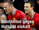 Jubel der Manchester-United-Spieler Wayne Rooney und Jonny Evans