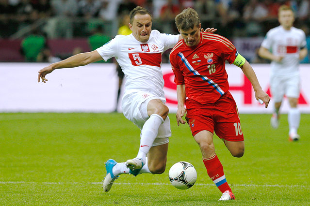 © Reuters/Pascal Lauener Dariusz Dudka (POL) gegen Andrej Arschawin (RUS)