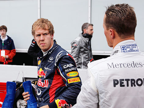 © Reuters/Wolfgang Rattay Sebastian Vettel und Michael Schumacher