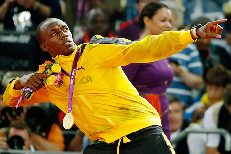 © dapd/AP/Matt Dunham Usain Bolt mit Goldmedaille bei den Olympischen Spielen 2012
