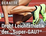 Leichtathlet am Start einer Laufbahn