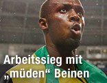 Usain Bolt hat die Jamaikanische Flagge umgehängt
