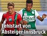 Thomas Bergmann (Innsbruck) and Karim Onisiwo (Mattersburg)