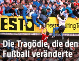 Stadionbesucher fallen von überfüllter Tribüne