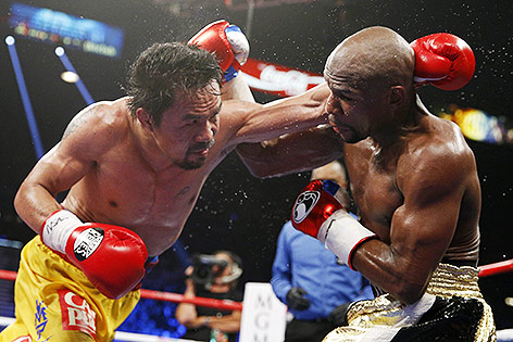 © AP/John Locher Manny Pacquiao und Floyd Mayweather Jr.