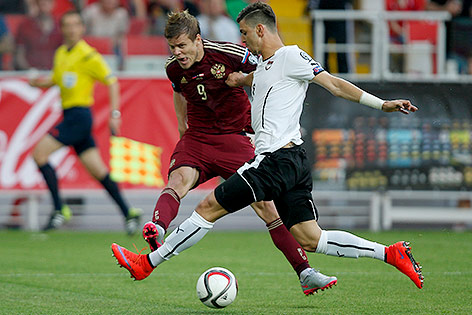 © APA/EPA/Yuri Kochetko Ivan Novoseltsev (RUS) und Zlatko Junuzovic (AUT)