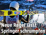 Ein Skispringer blickt am Schanzentisch nach unten