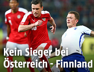 Zlatko Junuzovic (&Ouml;sterreicz) und Thomas Lam (Finnland)